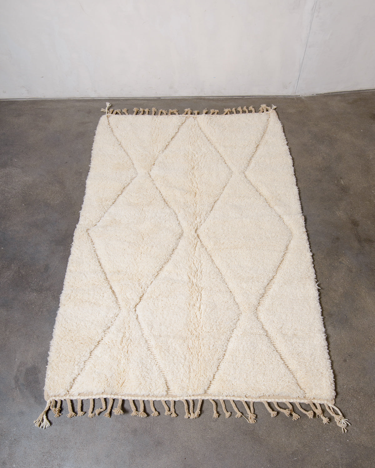 Modern, designer, handcrafted Berber rug from Morocco. Beniourain carpet with minimalist design, natural wool pile and a fluffy texture.